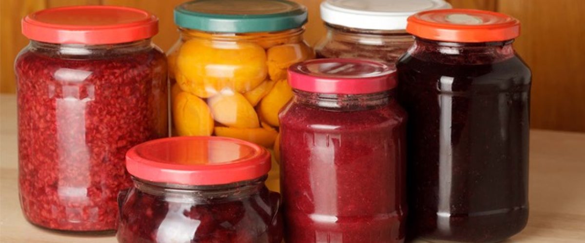 Various jams and compotes on table in kitchen